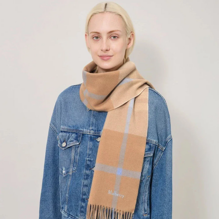 Mulberry Small Check Merino Wool Scarf camel and poplin blue shown on model with denim jacket. Model vs4319890f925.