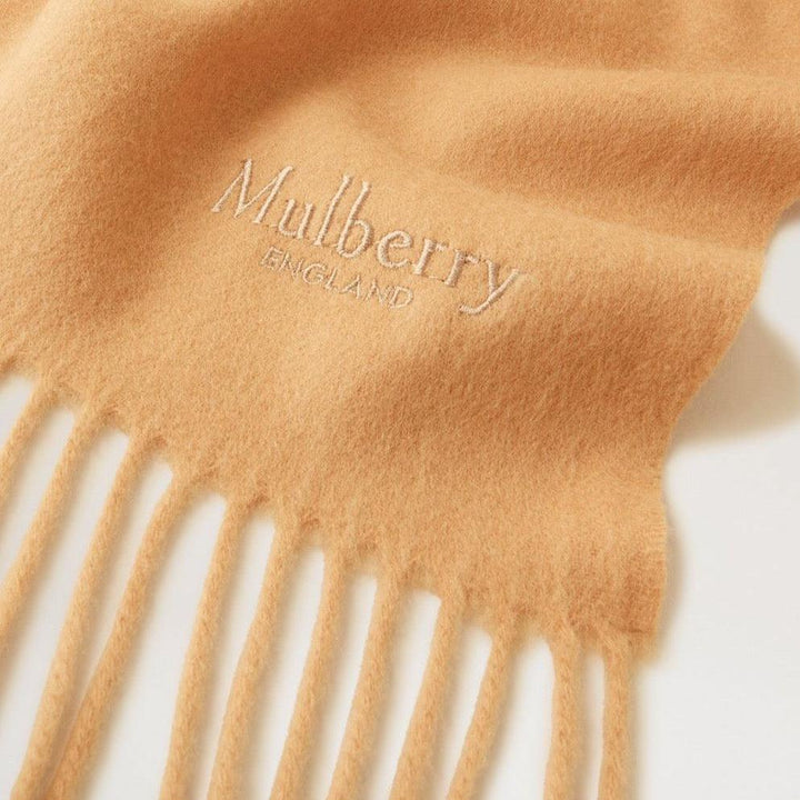 Mulberry Solid Merino Wool Scarf in camel colored merino wool with embroidered logo and fringes. Model VS4240947H150