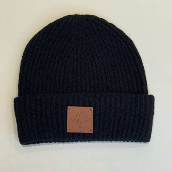 Mulberry Solid Wool Beanie Black, black ribbed wool beanie with brown logo patch on the front. Model vh4162163a100
