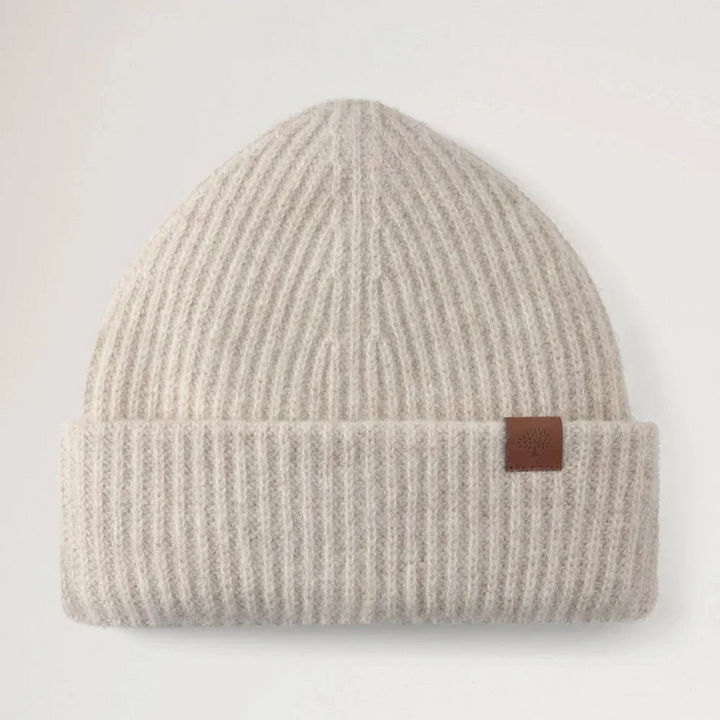 Mulberry Tree Chunky Wool Beanie Oat features a ribbed beige wool beanie with brown detailing. Model vh4157153h660