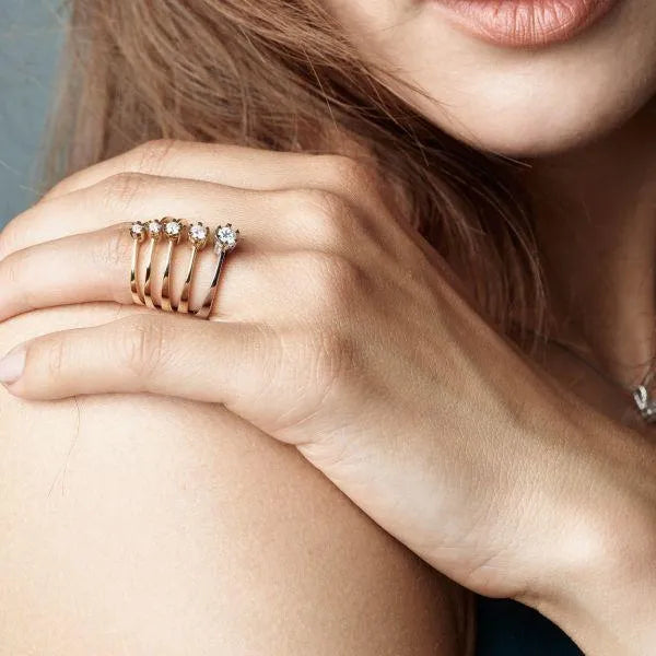 nuran-14kt-star-diamond-ring-with-0-03ct-w-si-l1964-003rg-001 shown on hand, elegant gold ring with brilliant. Model L1964-003RG-001
