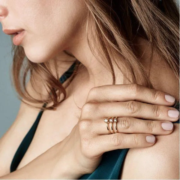 nuran-14kt-star-ring-0-05ct-w-si-l1964-005rg-001 beautiful gold ring with star design and diamond on woman's hand, Model L1964-005RG-001.