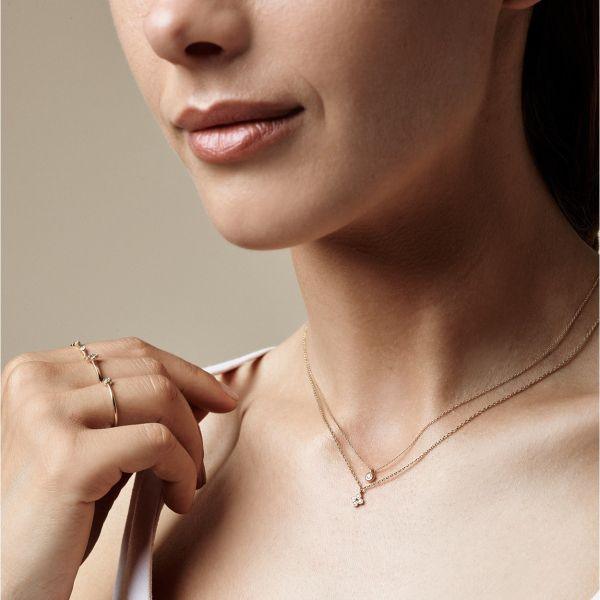 Nuran 14kt Zoe necklace 0.03ct WSI displayed on neck of woman, elegant gold with diamond. Model V2314-003RG-2.