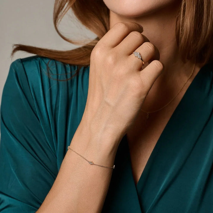 Nuran Athene 14kt bracelet 0.12ct W/SI displayed on woman's hand, elegant and discreet jewelry style. Model b2560-012rg-2.