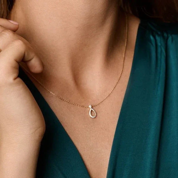 Nuran Mira 14kt necklace 0.14ct W/SI displayed on neck, elegant gold with diamond pendant. Model v2502-014rg-1.