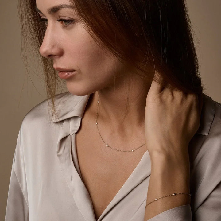 Nuran Zoe 14kt necklace with diamonds shown on woman, elegant and discreet rose gold. Model V1002-0175-RG