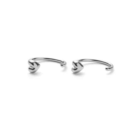 Pernille Corydon Adore hoop earrings in silver, two open earrings with heart details on a white background. Model E-506-S-1.