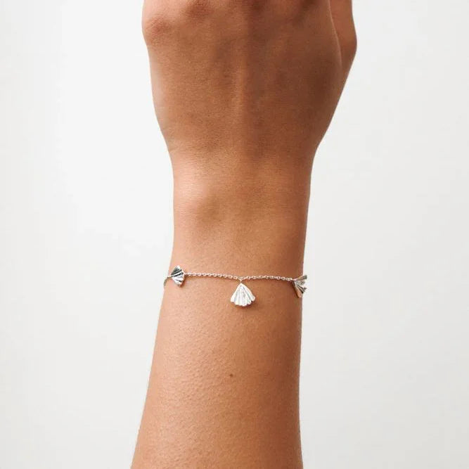 Pernille Corydon Autumn Leaf bracelet in silver shown on wrist with fine leaf pendants, Model B-497-S