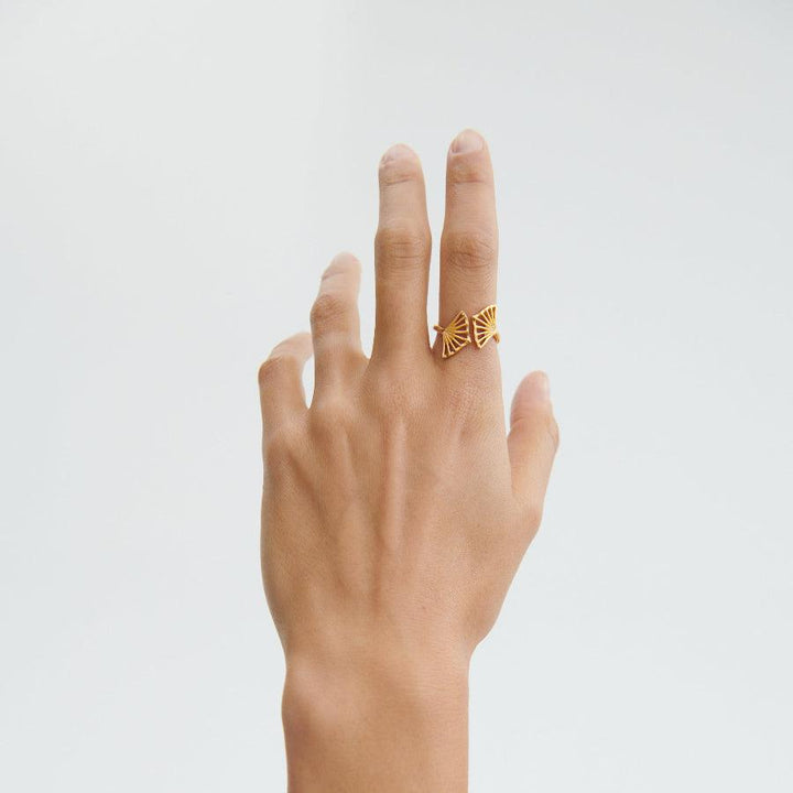 Pernille Corydon Ballerina silver ring worn on hand, open model with golden color, Model R-349-S-003