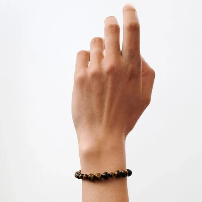 Pernille Corydon Earth Bracelet with brownish beads worn on wrist, simple style. Model B-322-GP