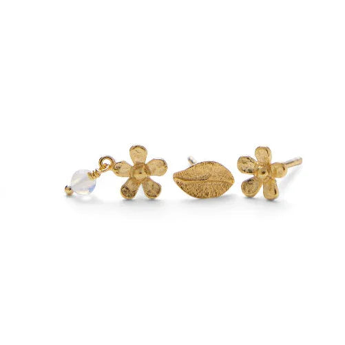 Pernille Corydon Meadow Earring Box in gold-plated shows three earrings: two flowers with matte gold and one with stones and a leaf motif. Model C-121-GP