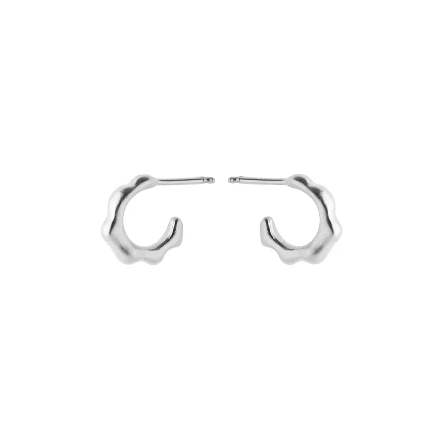 Pernille Corydon Small Aqua Hoops silver earrings with a wavy surface in a minimalist design. Model E-148-S-1.