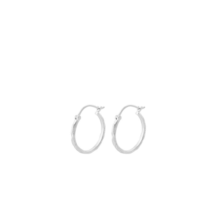Pernille Corydon Small Ice creoles in silver, two simple round earrings on a white background. Model E-236-S