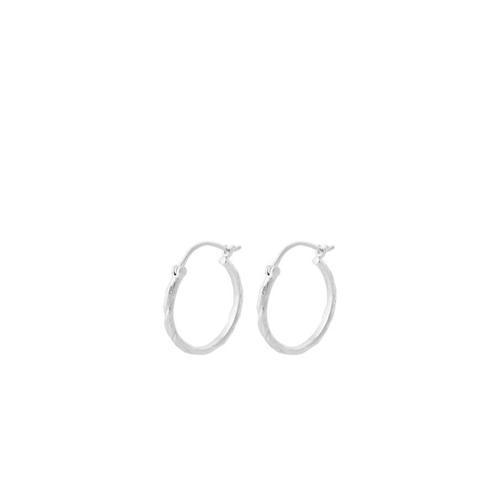 Pernille Corydon Small Ice creoles in silver, two simple round earrings on a white background. Model E-236-S