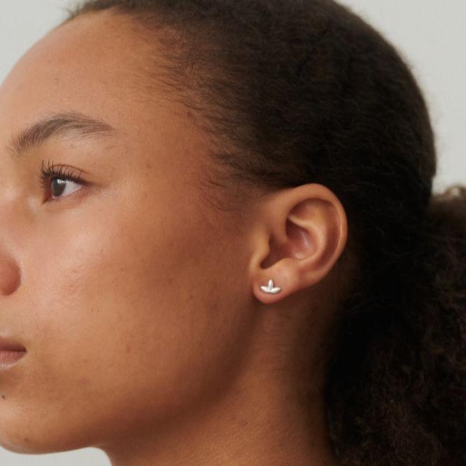 Pernille Corydon Whisper silver earrings appear worn on the ear, minimalistic and elegant. Model E-313-S-1