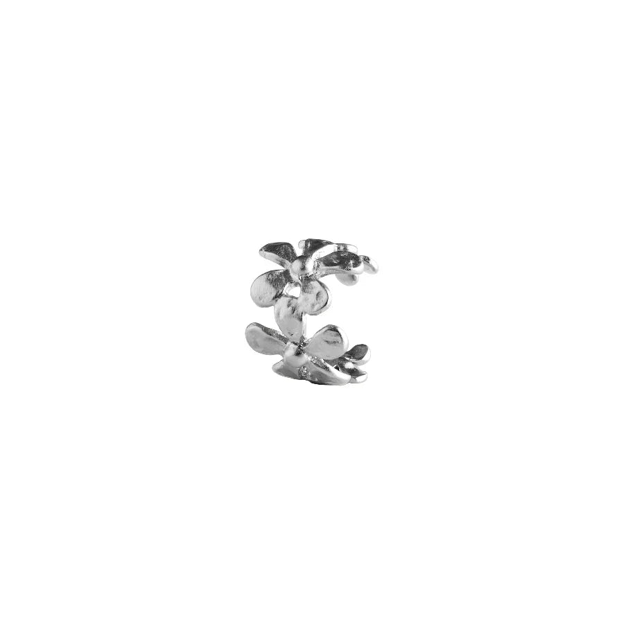 Pernille Corydon Wild Poppy Earcuff Silver shows an ear cuff in silver with a floral motif. Model E-367-S-1