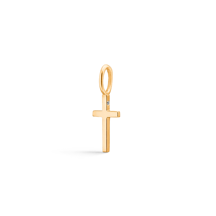 Ro Copenhagen 18kt Rock Cross p108y113-1 shows a simple cross pendant in yellow gold with diamond detail. Model p108y113-1.