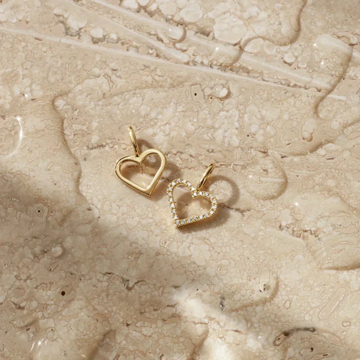 RO Copenhagen Symbols Open Heart pendant, two open heart pendants in 18 kt. gold on light marble base. Model p111y107