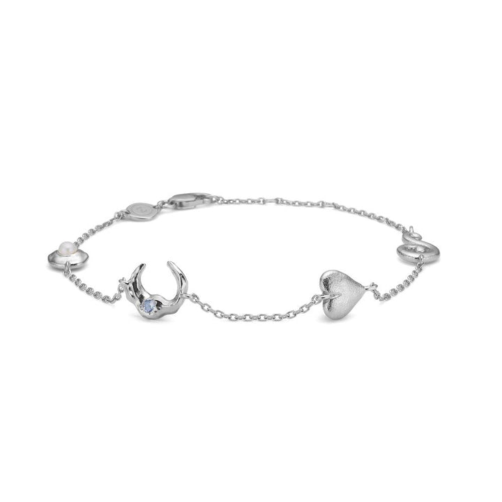 studio-z-cascade-solv-bracelet shows a silver bracelet with heart and moon pendant, Model7157875-1.