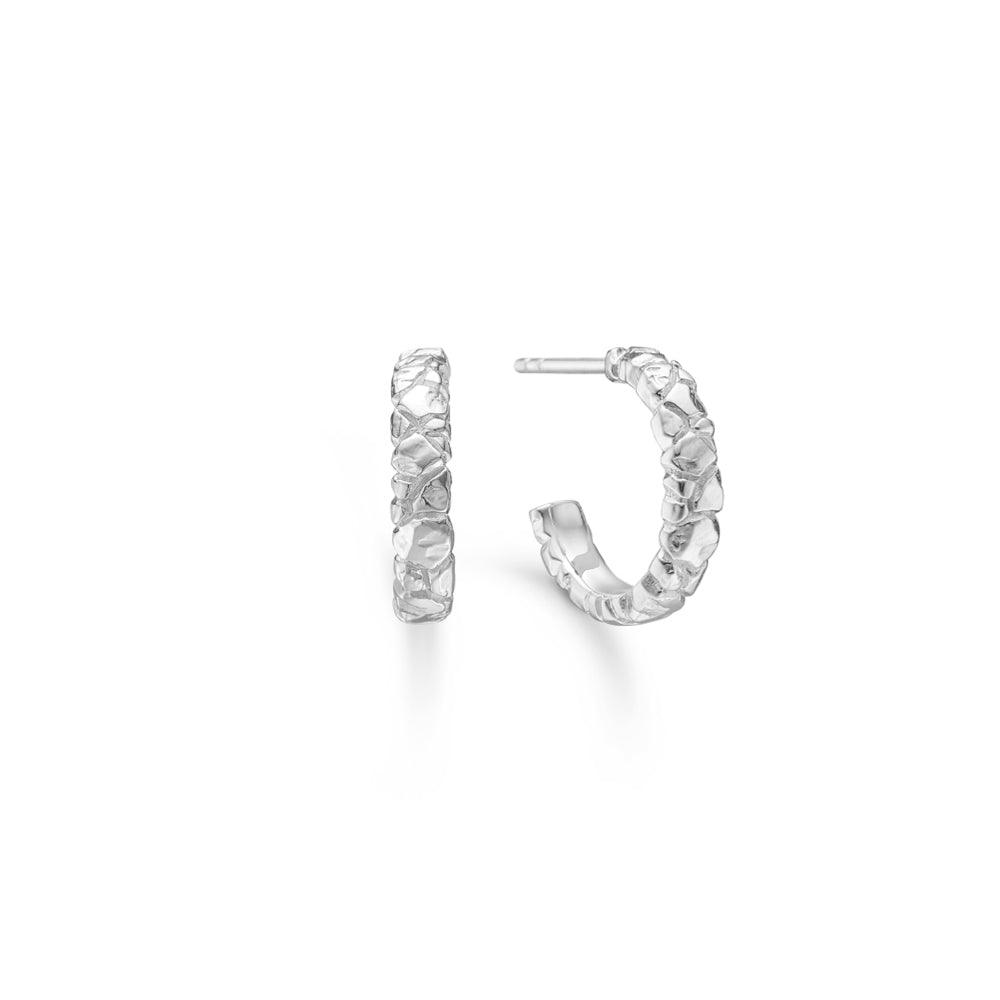 Element Creole silver earrings with raw, beaten surface shown against white background. Model 7110800-7110800-1