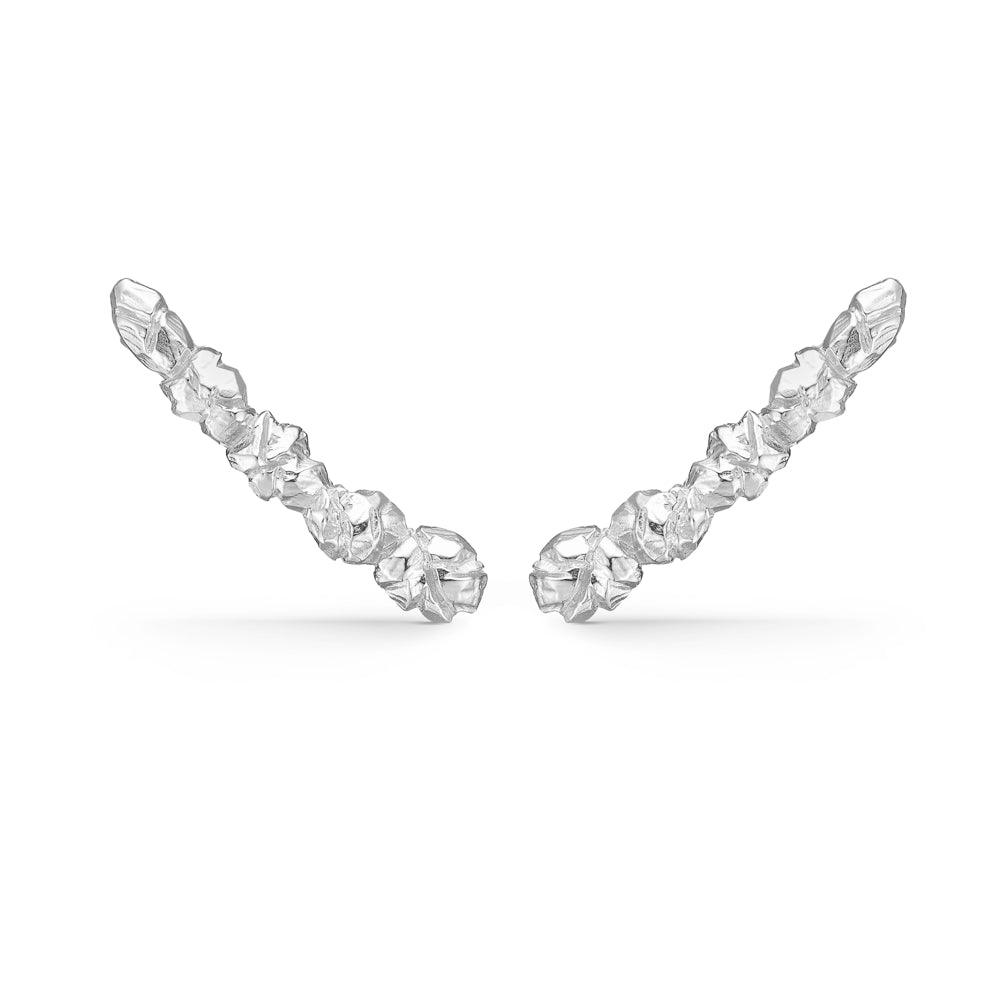Elements ORESTIK silver earrings with raw crystal structure on a white background. Model 7110856-1