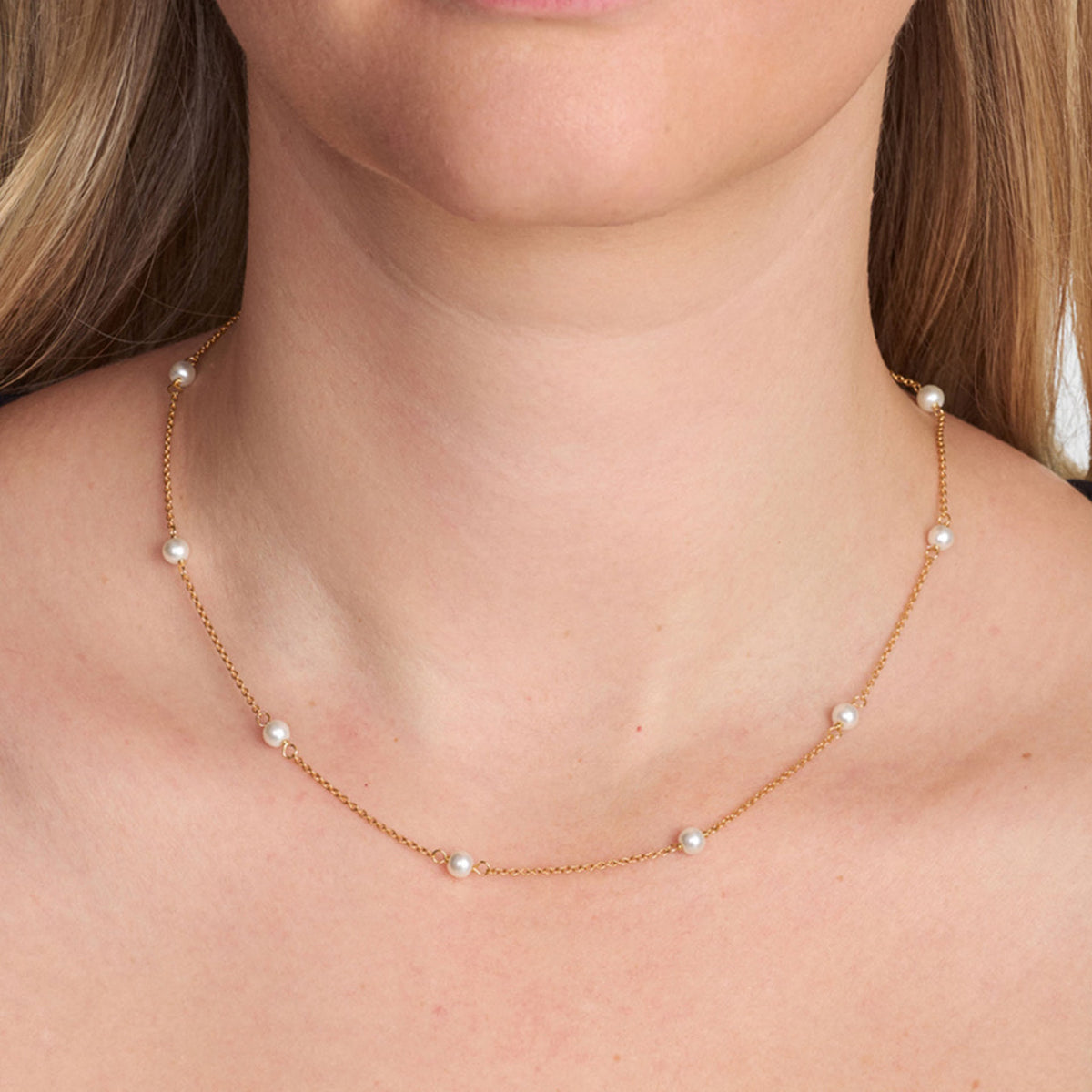 Studio Z Shore gold plated necklace with pearls displayed on neck, elegant and simple. Model 7223344-1.