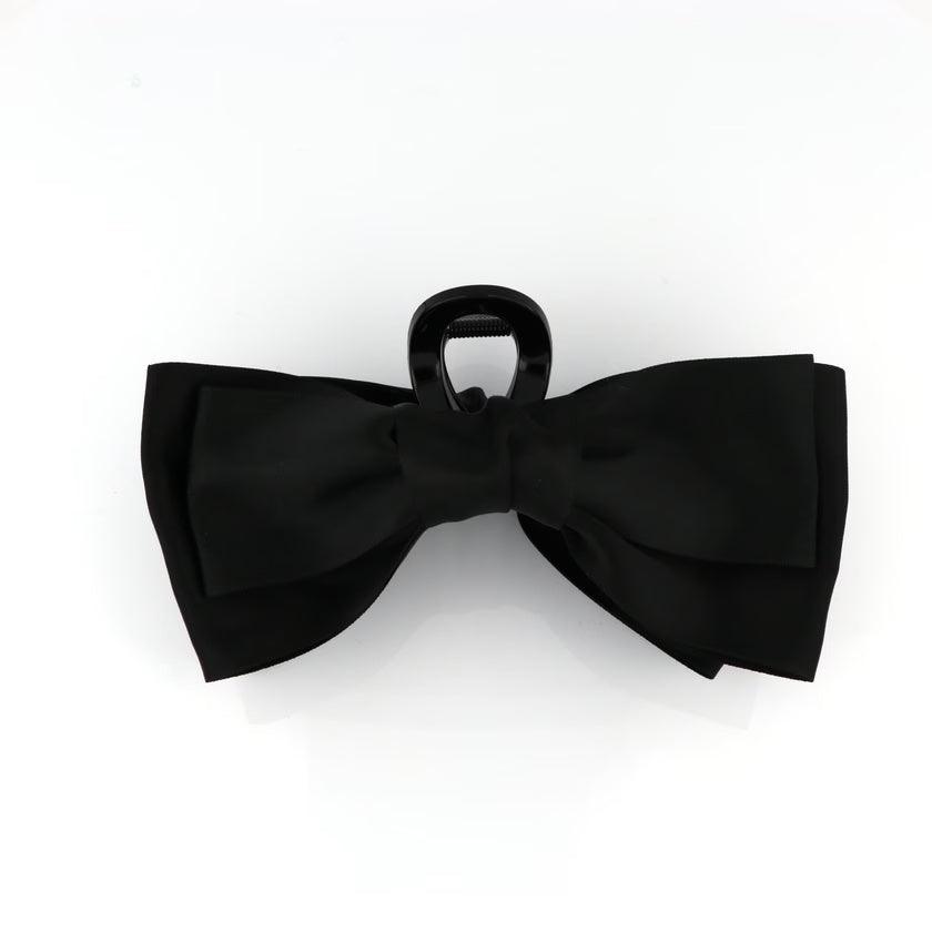 Studio Z XL Hair Clip Satin Bow Black shows an elegant black satin bow on a large hair clip. Model 7980021-1