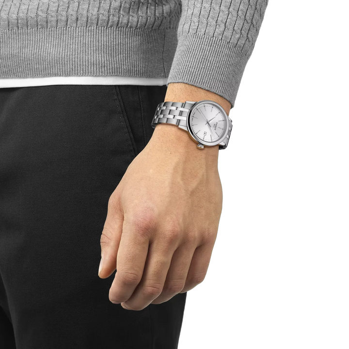 Tissot Classic Dream 42mm steel chain shown on wrist, watch in silver colored steel. Model T1294101103100