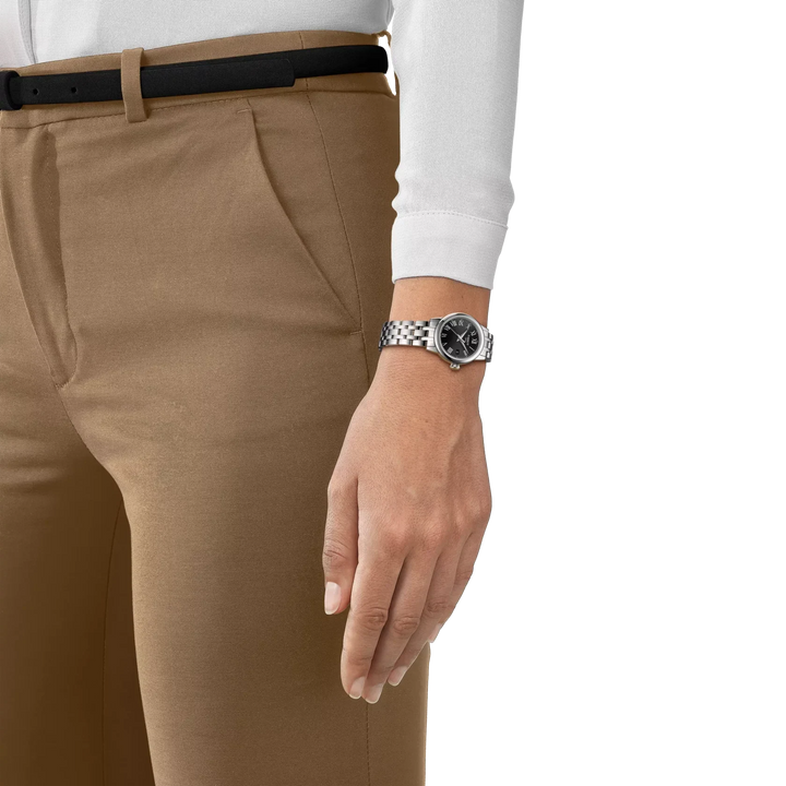 Tissot Classic Dream Lady on wrist, silver steel chain and black dial, Model T1292101105300.