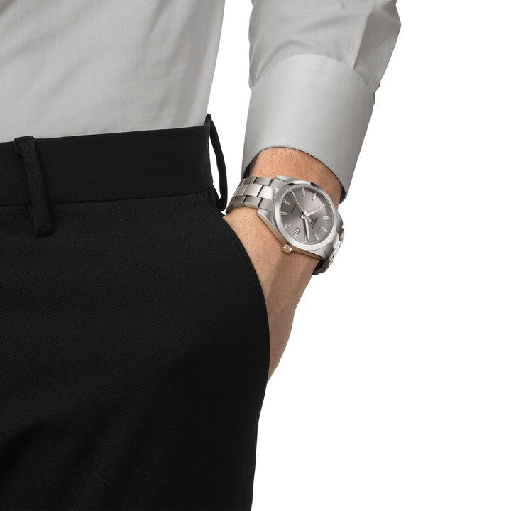 Tissot Gentleman Titanium T1274104408100 is shown on wrist with silver gray dial and titanium strap. Model T1274104408100.