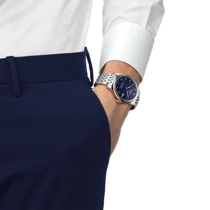 Tissot Le Locle Powermatic 80 is worn on the wrist, blue dial and steel bracelet. Model T0064071104300