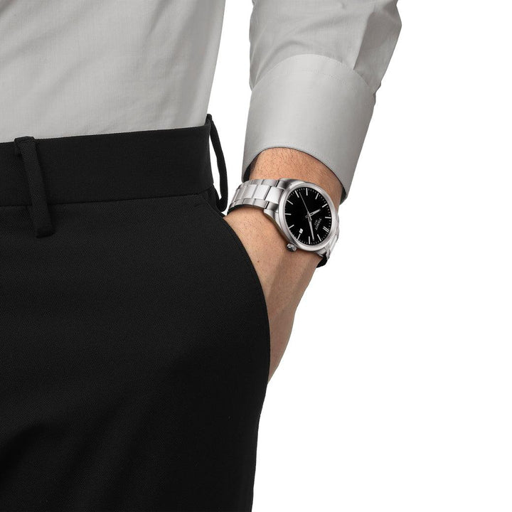 Tissot PR 100 T1504101105100 on wrist, silver wristwatch with black dial in classic design. Model T1504101105100.
