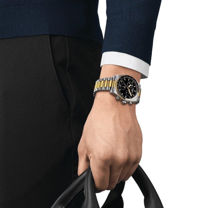 Tissot PR516 Chronograph gold PVD with black dial worn on wrist, Model T1494172205100