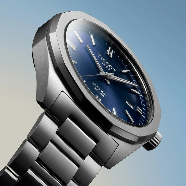 Tissot PRC 100 Solar Quartz 39mm with blue dial and steel link seen closely, Model T1514221104100