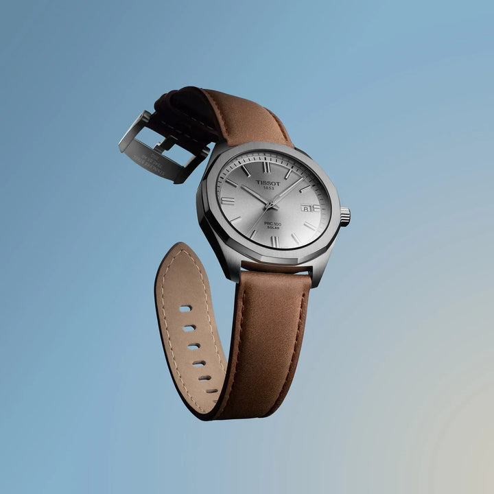 Tissot PRC 100 Solar Quartz 39mm brown leather strap, silver dial on blue background. Model T1514221603100