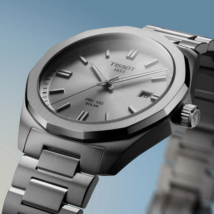 Tissot PRC 100 Solar Quartz 39mm with silver dial and steel chain, close-up. Model T1514221103100.