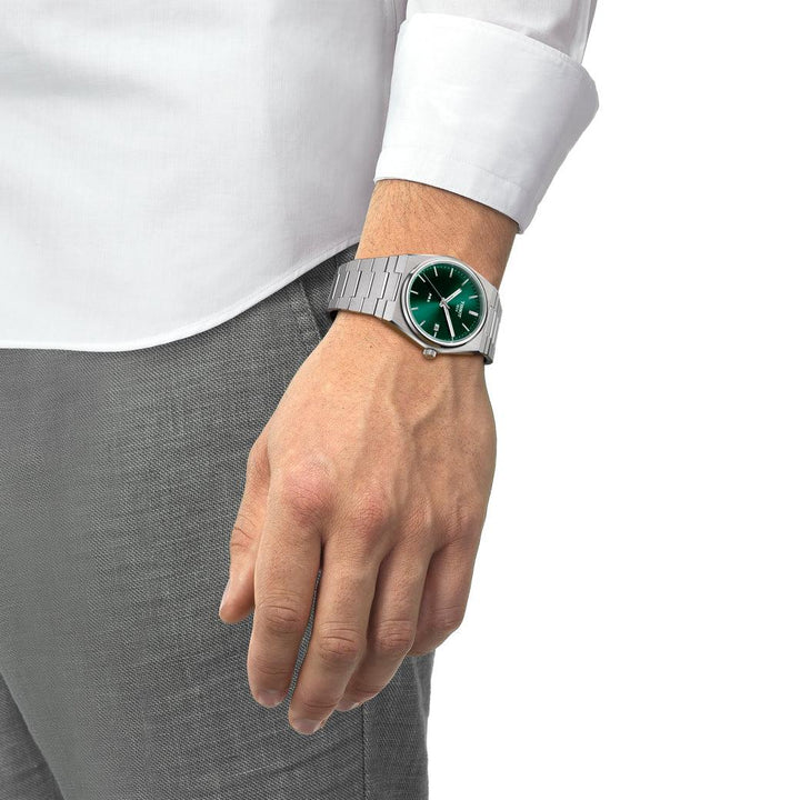 Tissot PRX 40mm green dial on wrist, steel watch with silver strap. Model T1374101109100