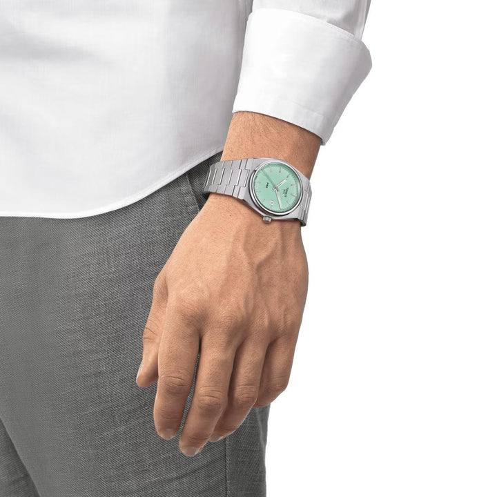 Tissot PRX 40mm Ice Blue dial displayed on wrist, with silver steel chain. Model T1374101109101.