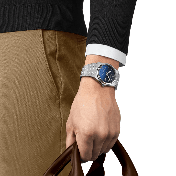 Tissot PRX Powermatic 80 40mm on wrist, blue dial and silver steel chain. Model T1374071105101