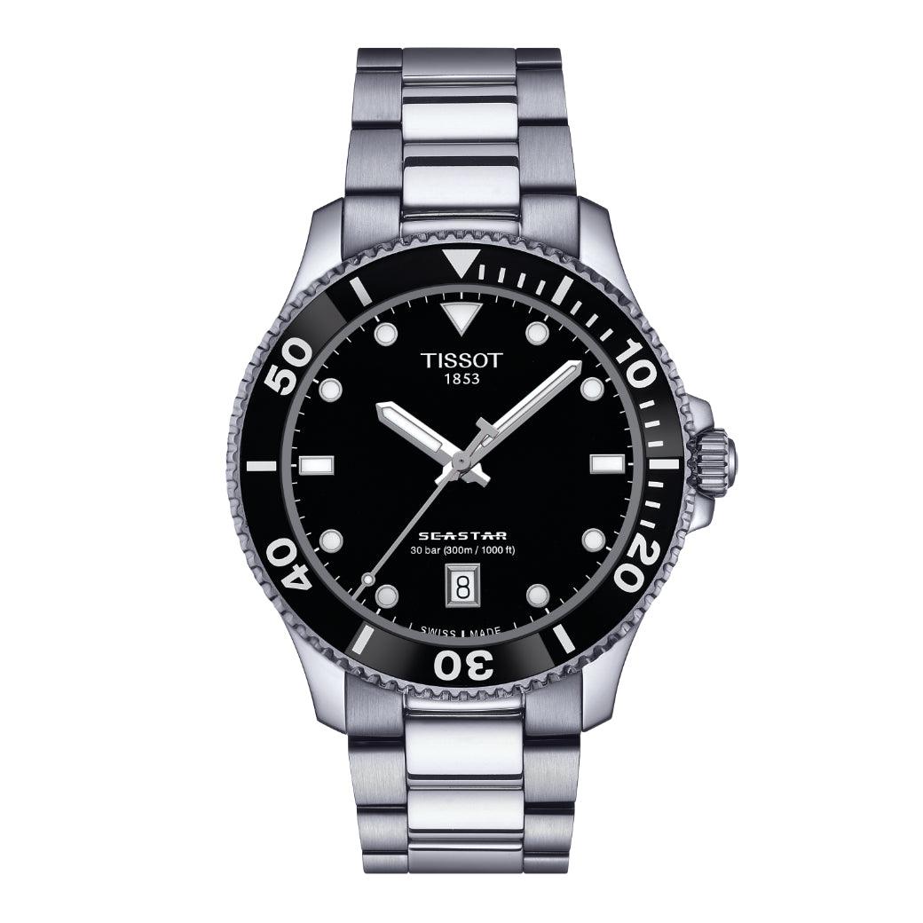 Tissot Seastar 1000 40mm shows a silver wristwatch with black dial and distinct white markings, Model T1204101105100.