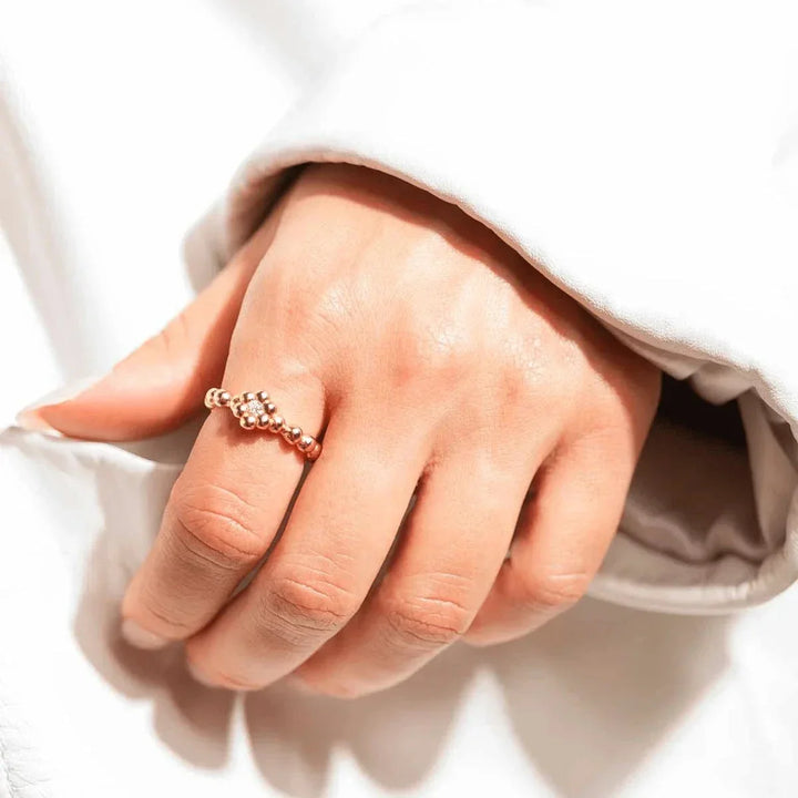 Vincent Bloom Ring Gold Plated w/ White Crystal worn on hand, gold colored pearl ring with clear stones, Model VJ253-URG-001-1.
