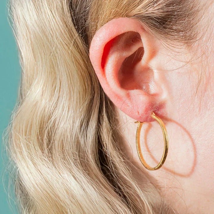 Vincent Fortune Teller Creole Gold Plated Earrings Large 25mm shown worn on ear, elegant golden creole model, Model VJ078-UEG-L-1.
