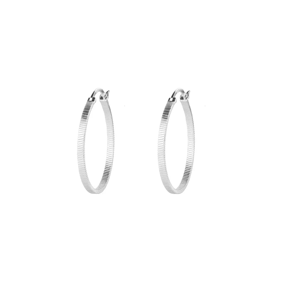 Vincent Fortune Teller Creole Silver Earrings Large shows a pair of large, grooved silver creoles against a white background. Model vj078-ues-l-1.