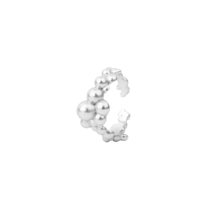 Vincent Orb Inferior Silver Ring shown as an open silver ring with dented ball detailing. Model vj215-urs-001-1