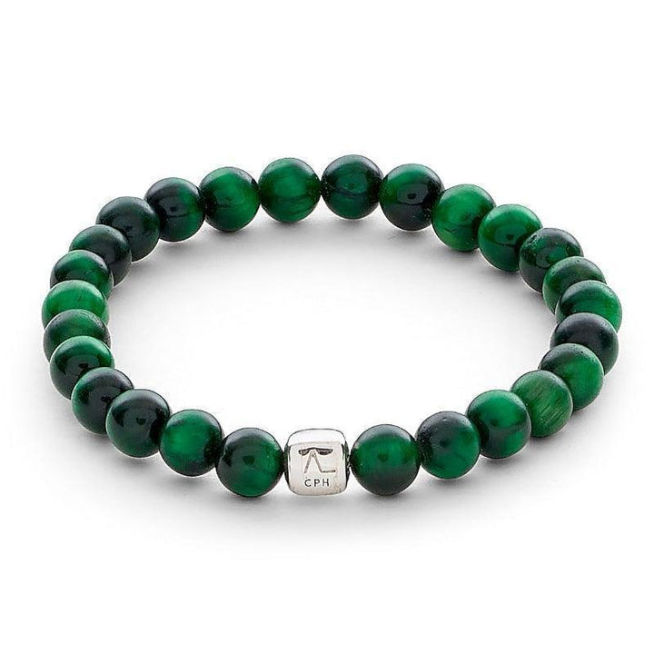 Alexander Lynggaard Armband Green Tiger Eye 6mm shows an elastic bracelet with green tiger eye beads and a silver colored detail. Model c00353-001-1