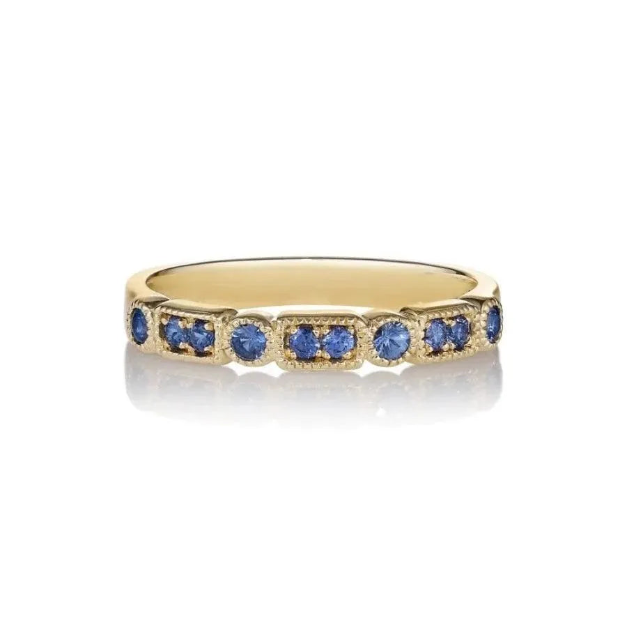 anpé atelier trine ji blue ring shown close up, with blue stone in detailed gold band. Model 2566-001-1