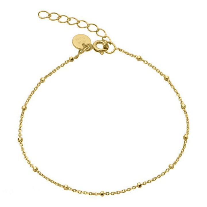 Aqua Dulce Dee Dot Bracelet Silver Plated shows a fine, thin bracelet in gold finish with small decorative balls. Model 1471-1471-1