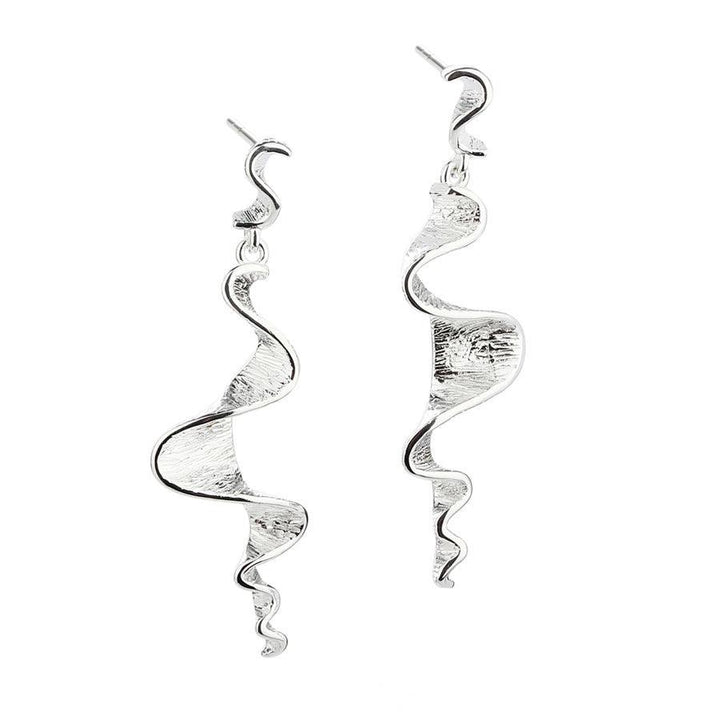 Aqua Dulce Rhumba Long Earrings in silver with a twisted, structured design on a white background. Model 5101-5101-1