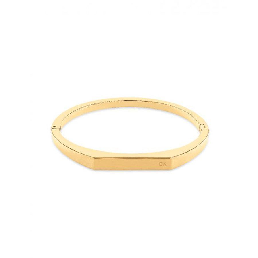 Calvin Klein Faceted Bar Bangle Black Gold, elegant faceted gold bangle with smooth surface. Model 35000046-35000046