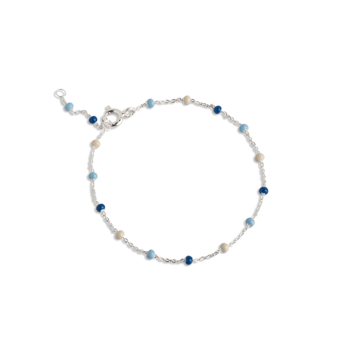 Enamel Lola Bracelet Marine shows a whimsical bracelet with small blue and cream pearls, Model b66s-marine-1.